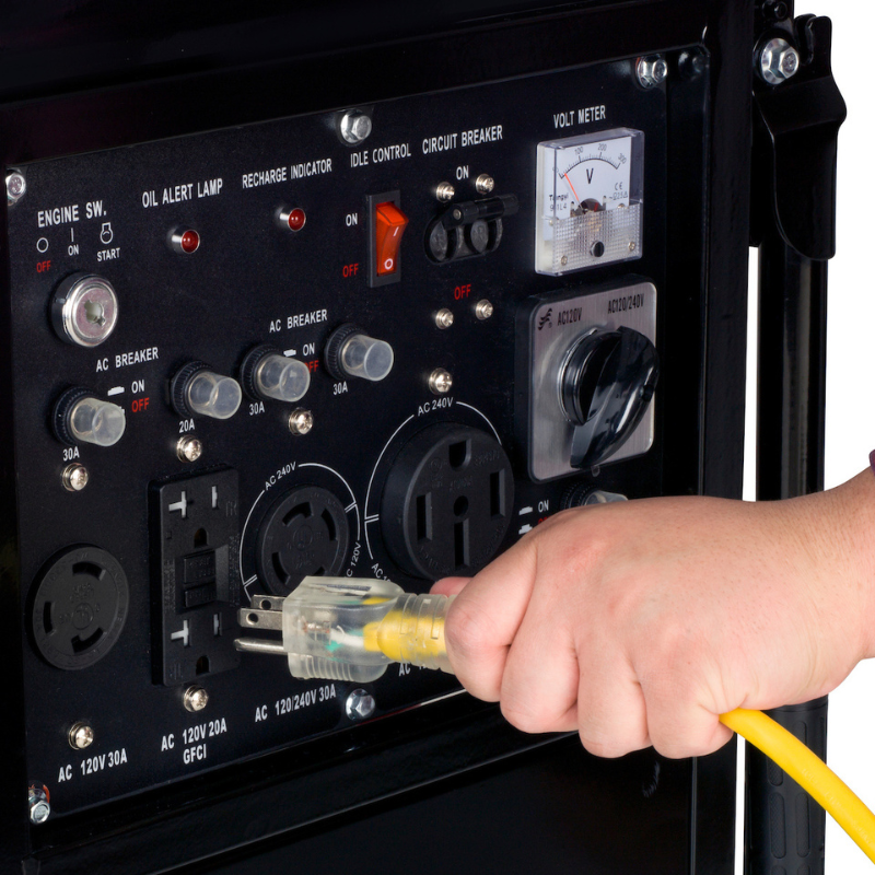 Plugging a cord into the DuroMax 10000 Watt Portable Generator