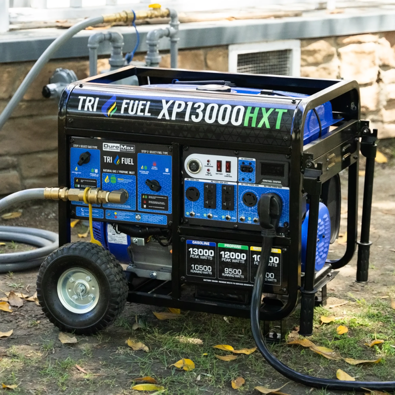 the DuroMax 13000 Watt Tri Fuel Portable Generator w/ CO Alert hooked up outside