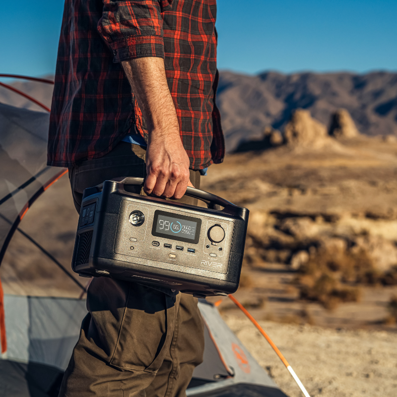 EcoFlow RIVER Portable Power Station carrying it in the desert