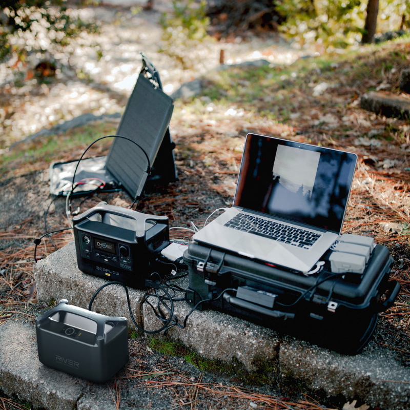 EcoFlow RIVER Pro Portable Power Station being used outside in nature to charge a laptop