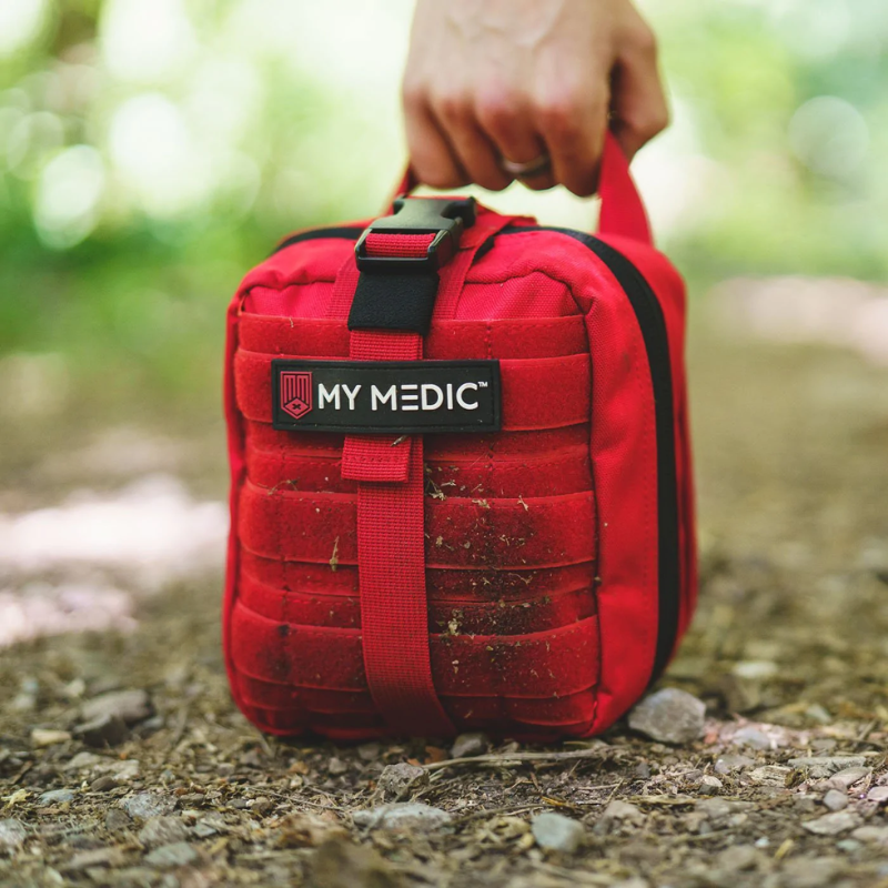 the My Medic MYFAK First Aid Kit carried in the woods